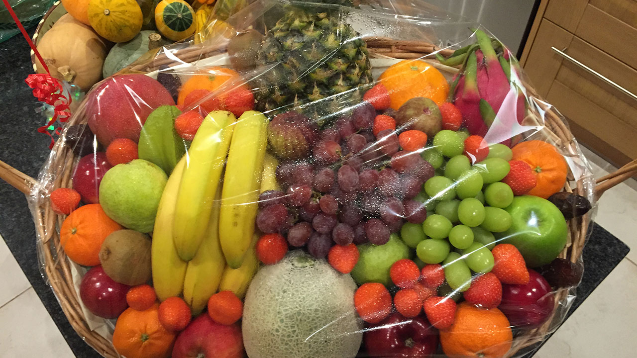 Large basket filled with mixed fresh fruit