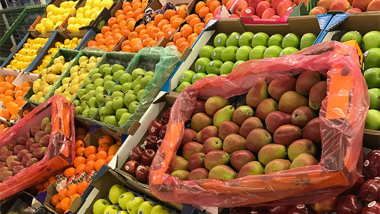 Selection of fresh fruit including pears, apples and oranges